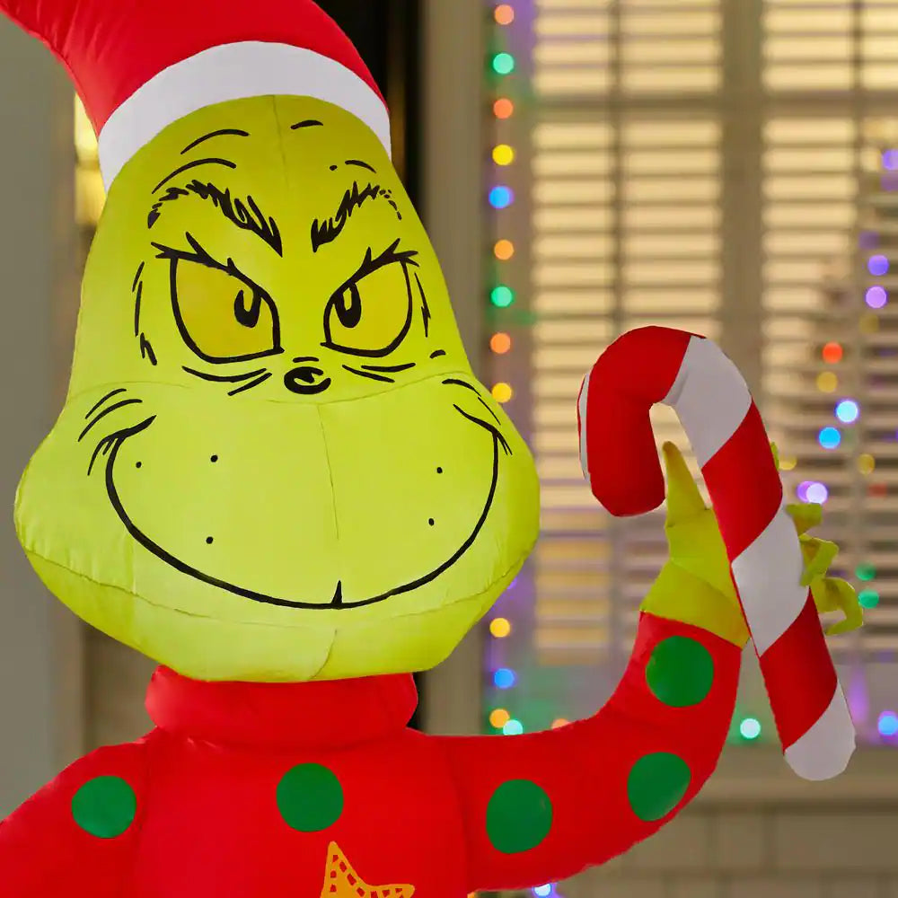 4 Ft. LED Grinch in Ugly Sweater with Candy Cane Christmas Airblown® Inflatable